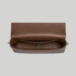 Top interior view of brown slouchy crossbody bag showing a spacious main compartment for daily essentials