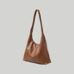 Brown vintage soft leather hobo bag with a natural slouchy drape and adjustable strap.