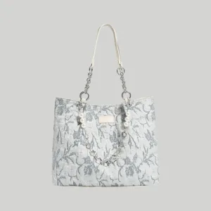Light blue floral embossed leather tote bag featuring a pearl chain strap, Chinoiserie chic aesthetic