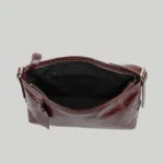 Open interior view of spacious burgundy work tote showing secure zipper pocket and premium lining.
