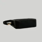 Flat structured bottom view of the black pebbled leather purse, showcasing its 9cm depth and sturdy base