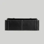 Structured bottom view of black textured PU leather briefcase with white stitching.