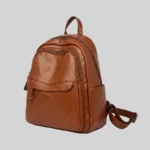 Angled view of brown structured vegan leather backpack ready for B2B private label manufacturing