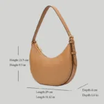 Exact size measurements of the structured crescent shoulder bag showing length 11.42 inches, height 8.5 inches, and depth 1.6 inches.