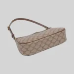 Bottom view of manufactured PU underarm bag showcasing reinforced piping and precision contrast stitching.