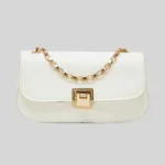 Front view of quiet luxury white commuter bag featuring a curved silhouette, half-flap design, and square gold hardware.