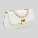 Angled front view of minimalist white synthetic leather shoulder bag with thick gold-tone chain and push-lock closure.