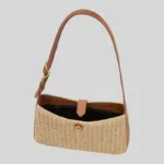 Interior view of summer woven bag showing black fabric lining, inner zip pocket, and magnetic snap closure