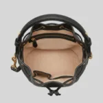 Contrast micro-suede interior of top-grain cowhide bucket bag showing main compartment, zip pocket, and slip pockets.