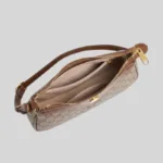 Interior layout of wholesale women's faux leather commuter bag featuring multi-compartment design and central zip divider.