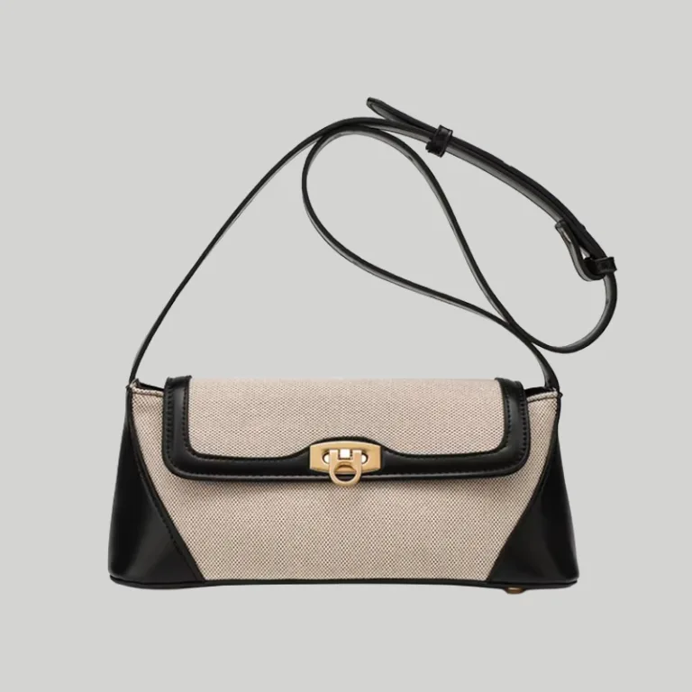 Structured two-tone canvas and leather trim shoulder bag with gold hardware front view
