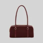 Front view of a burgundy structured double-zip handbag with long shoulder straps