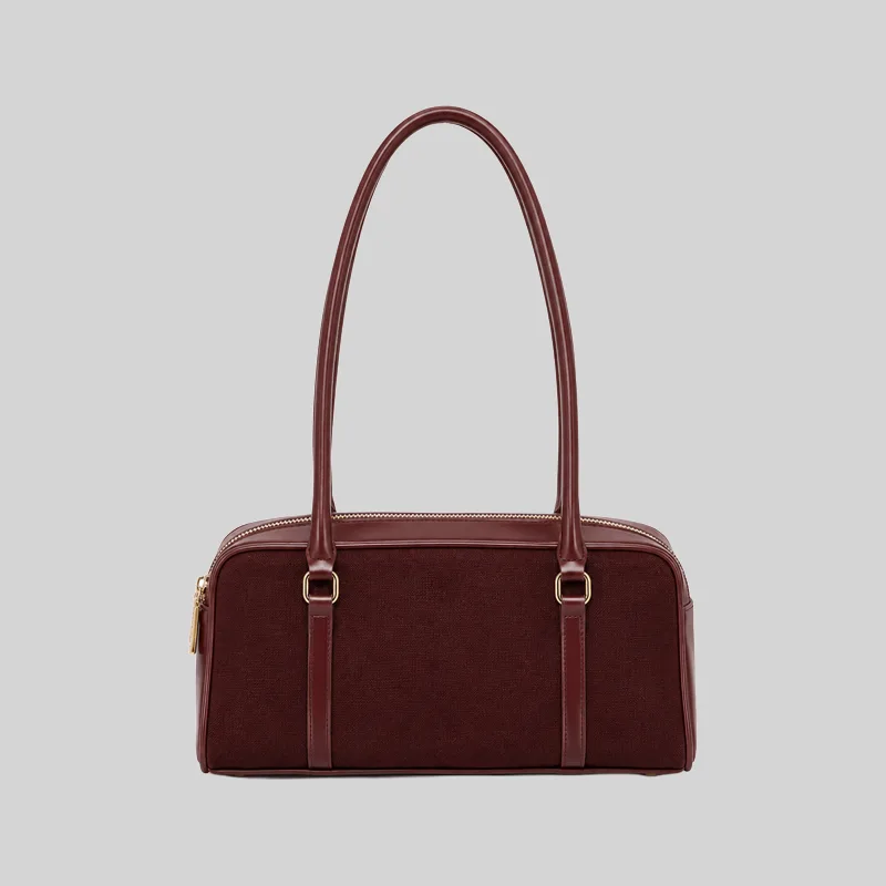 Front view of a burgundy structured double-zip handbag with long shoulder straps