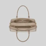 Top open view of the beige shoulder bag showing dual compartments, interior lining, and zip pockets