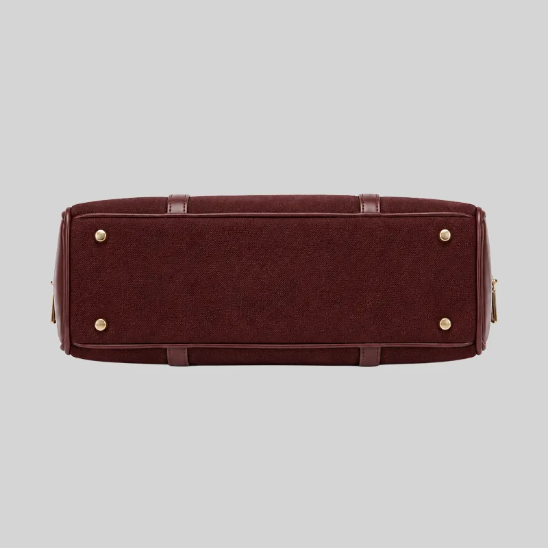 Top open view of the shoulder bag showing dual compartments, interior lining, and zip pockets, burgundy