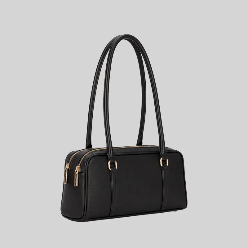Side view of the structured commuter shoulder bag showing the double zip closure and gold-tone hardware, black