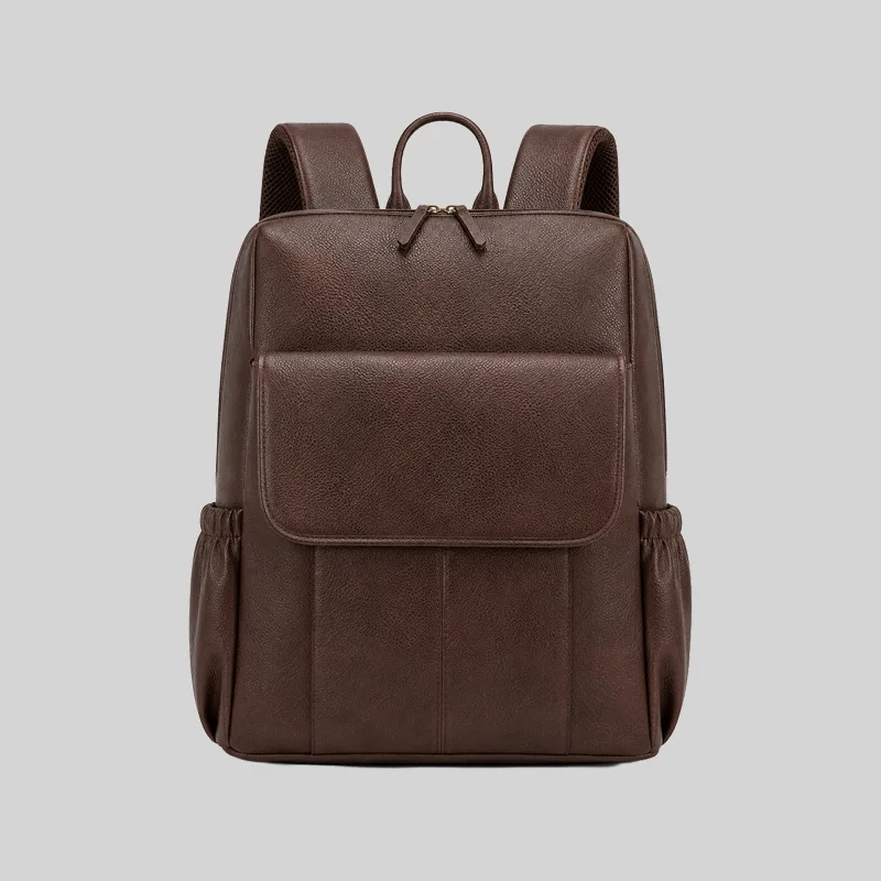 Front view of the dark brown pebbled vegan leather commuter backpack featuring a minimalist flap pocket