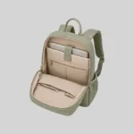 Open interior view of the sage green PU work backpack showing organizational pockets and light lining