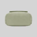 Structured flat bottom view of the sage green PU commuter backpack showing reinforced stitching