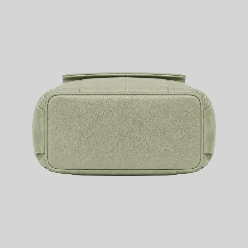 Structured flat bottom view of the sage green PU commuter backpack showing reinforced stitching