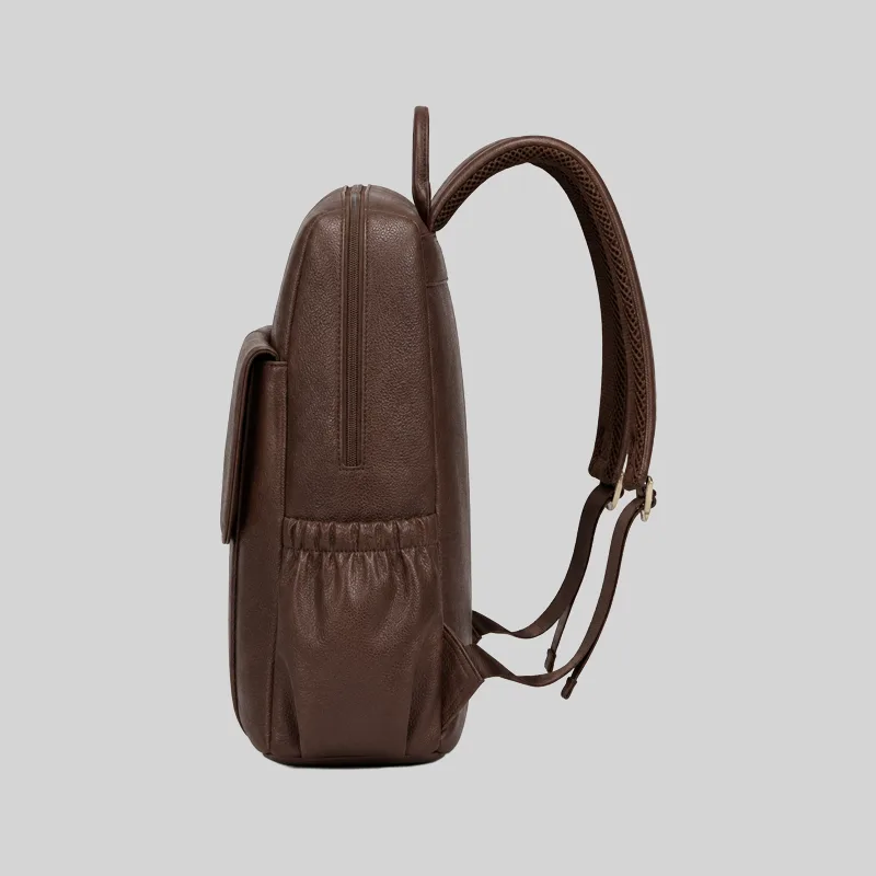 Side profile of the structured dark brown PU laptop daypack showing the elasticized side pocket.