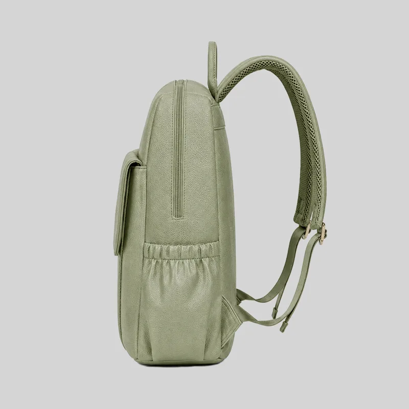 Side profile of the sage green vegan work backpack showing the water bottle pocket and ergonomic straps